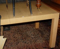 Lot 1279 - A contemporary light oak extending dining...