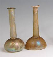 Lot 88 - Two Roman iridescent glass flasks, each with...