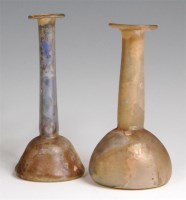 Lot 89 - Two Roman iridescent glass flasks, each with...