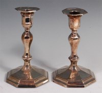 Lot 142 - A pair of silver candlesticks, in the early...