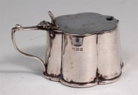 Lot 164 - A George V silver lidded mustard, of lobed...
