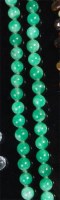 Lot 197 - A beaded and knotted jade necklace, with 9ct...