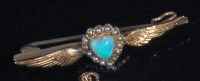 Lot 216 - A 15ct gold opal and seed pearl set wings bar...