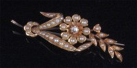 Lot 217 - A circa 1900 yellow gold pearl and diamond set...