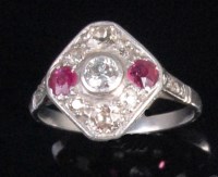 Lot 220 - A platinum ruby and diamond set panel ring,...
