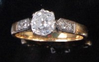 Lot 225 - An 18ct gold diamond solitaire ring, the claw...