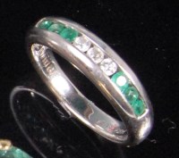 Lot 236 - A modern 14ct white gold emerald and diamond...
