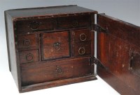 Lot 284 - An antique oak wall cupboard, having single...