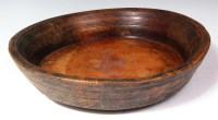 Lot 285 - An 18th century treen shallow bowl, the raised...