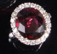 Lot 191 - A contemporary 18ct white gold garnet and...