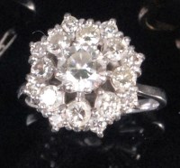 Lot 223 - An 18ct white gold diamond cluster ring,...