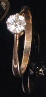 Lot 239 - An 18ct gold diamond solitaire ring, the claw...