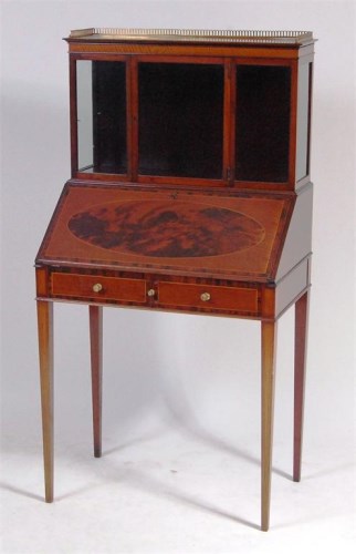 Lot 574 - A circa 1900 fiddle-back and flame mahogany...