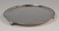 Lot 1203 - A George III silver salver, having a raised...