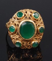 Lot 1230 - A ladies 18ct gold and emerald set dress ring,...