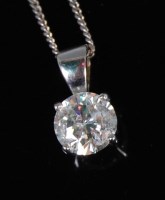 Lot 1235 - An 18ct white gold and diamond set pendant,...