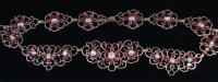 Lot 1238 - A circa 1900 yellow metal garnet and pearl set...