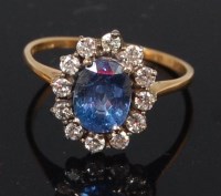 Lot 1241 - A ladies 18ct gold sapphire and diamond...