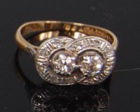 Lot 1243 - A ladies 18ct gold and platinum diamond two...