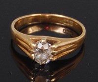 Lot 1258 - An 18ct gold diamond solitaire ring, the claw...