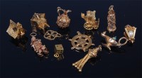 Lot 1262 - Twelve various modern 9ct gold charms, to...