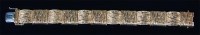 Lot 1264 - A modern 18ct gold fancy squarelink bracelet,...