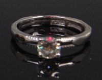 Lot 1280 - A contemporary ladies platinum diamond...