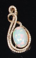 Lot 1281 - A 14ct yellow gold and Ethiopian cabochon opal...