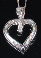 Lot 1282 - A modern 10ct white gold and diamond set heart...