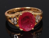 Lot 1295 - A modern ladies 18ct gold ruby and diamond...