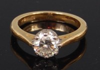 Lot 1311 - A modern ladies 18ct gold diamond solitaire...