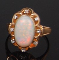 Lot 1320 - A ladies 18ct gold opal and diamond set dress...