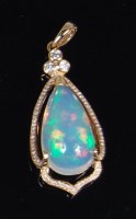 Lot 1322 - An 18ct gold and Ethiopian opal set pendant,...