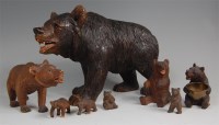 Lot 1340 - A circa 1900 Black Forest carved bear, in...