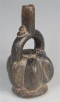 Lot 1345 - A Peruvian pre-Columbian stirrup spout pottery...