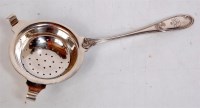 Lot 87 - A silver plated tea Strainer, the terminal...