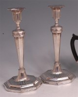 Lot 642 - A pair of Edwardian silver candlesticks in the...