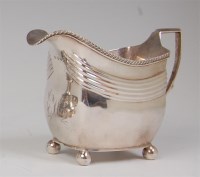 Lot 666 - A late Georgian silver cream jug, having a...