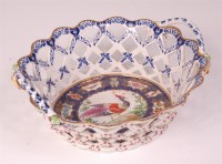 Lot 606 - An 18th century Bow porcelain basket, lattice...