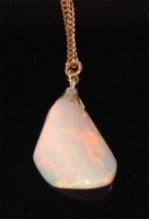 Lot 687 - A heavy polished opal pendant on 14ct gold...