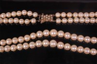 Lot 691 - A graduated pearl double string choker, having...