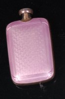 Lot 701 - A guilloche pink enamel on white metal scent...