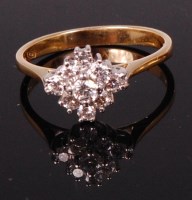 Lot 705 - An 18ct yellow gold diamond cluster ring, the...