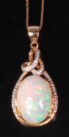 Lot 711 - A modern 14ct yellow gold opal and diamond...