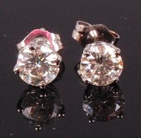 Lot 715 - A pair of 14ct white gold diamond set ear...