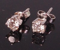 Lot 717 - A pair of 18ct white gold diamond set ear...