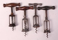 Lot 752 - Four early 20th century steel corkscrews,...