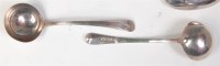 Lot 669 - A pair of George III silver sauce ladles, each...