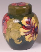 Lot 21 - A Moorcroft Hibiscus pattern pottery ginger...