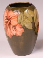 Lot 23 - A Moorcroft Hibiscus pattern pottery vase, of...